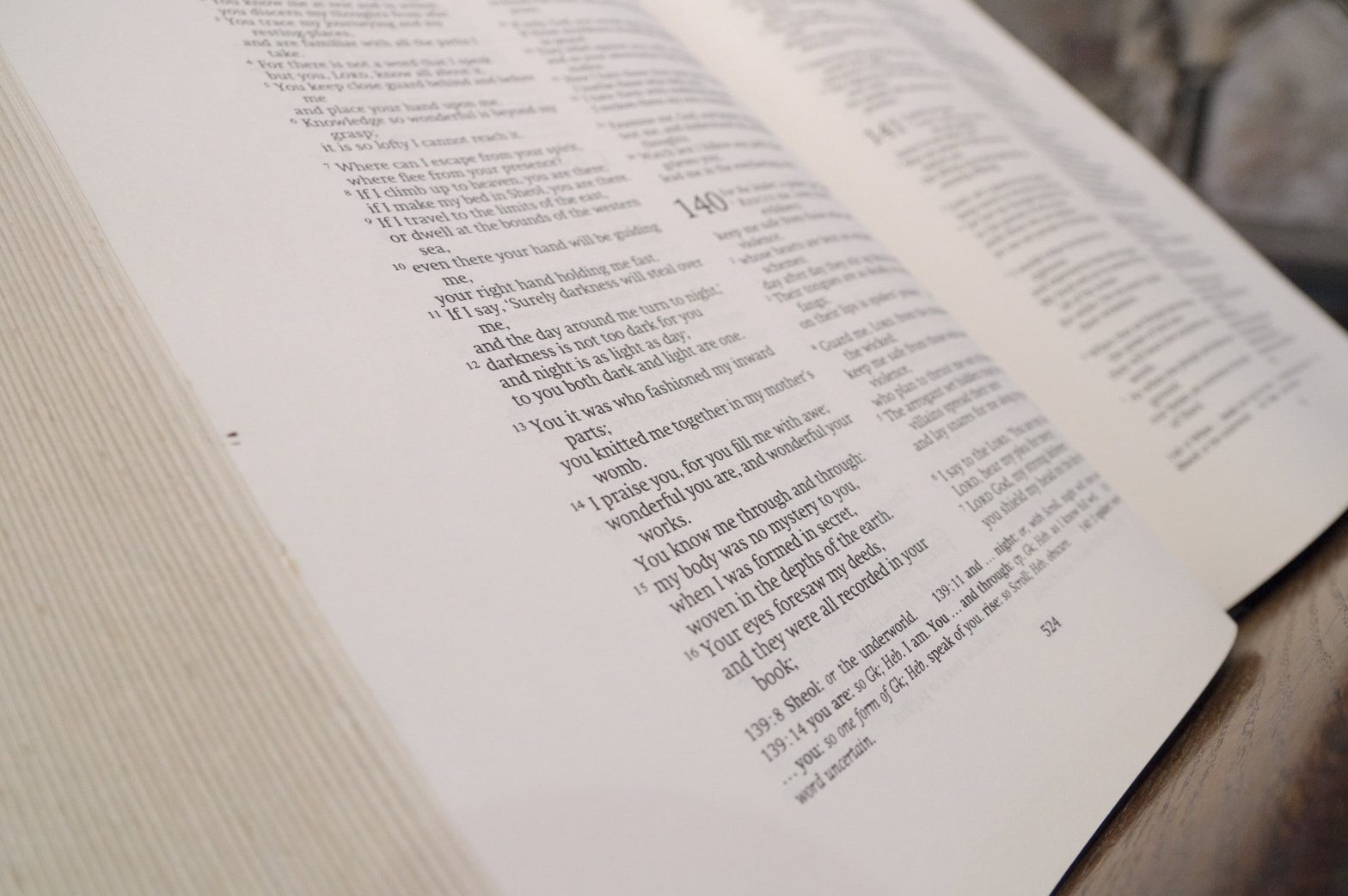 An open Bible on a stand