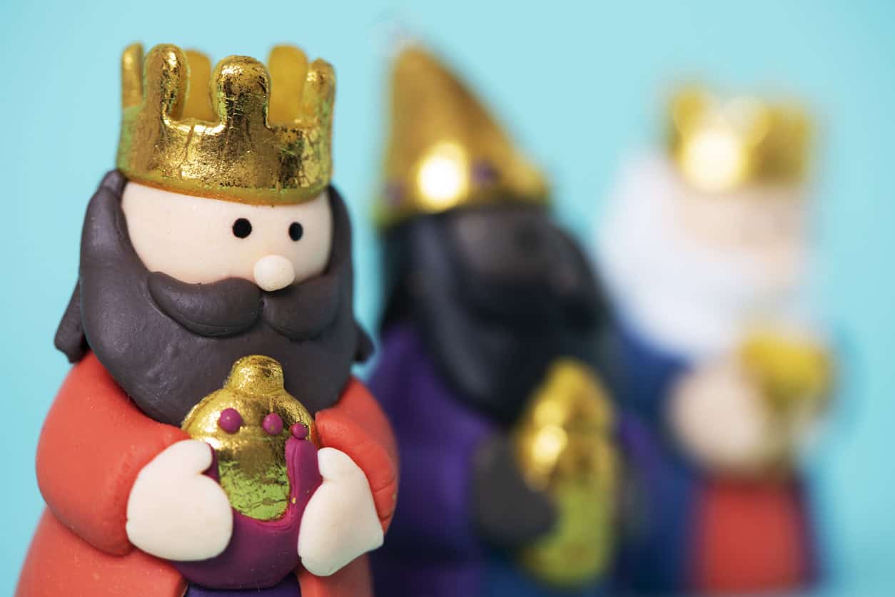 Close up of small toy three wise men figures.