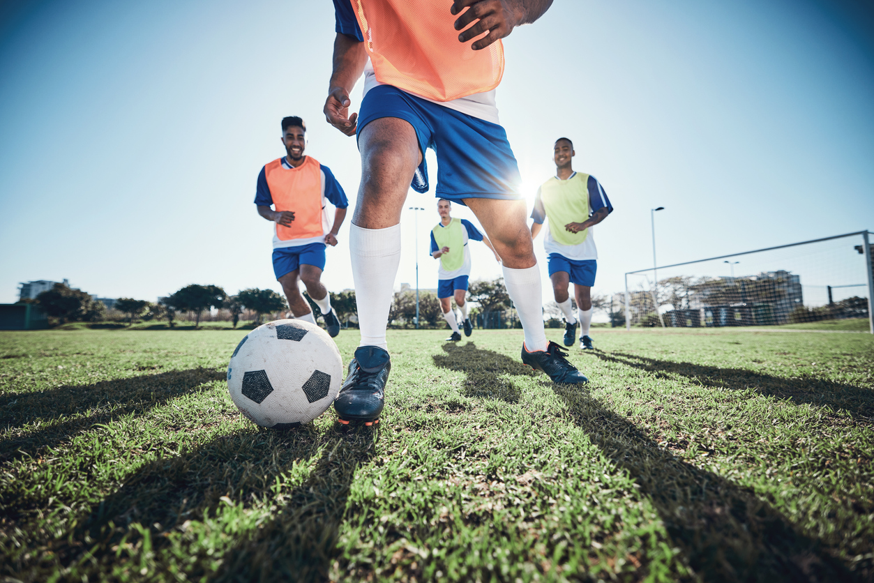 Young people playing football.