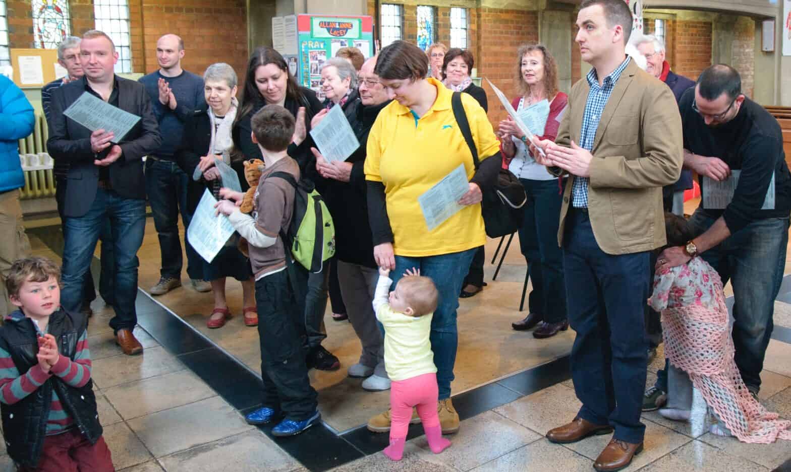 Informal congregation standing around in a modern church
