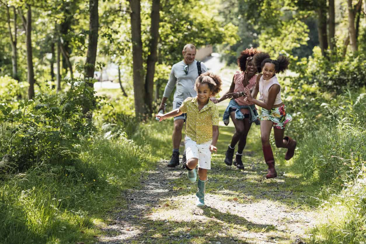 Family walking through a wood