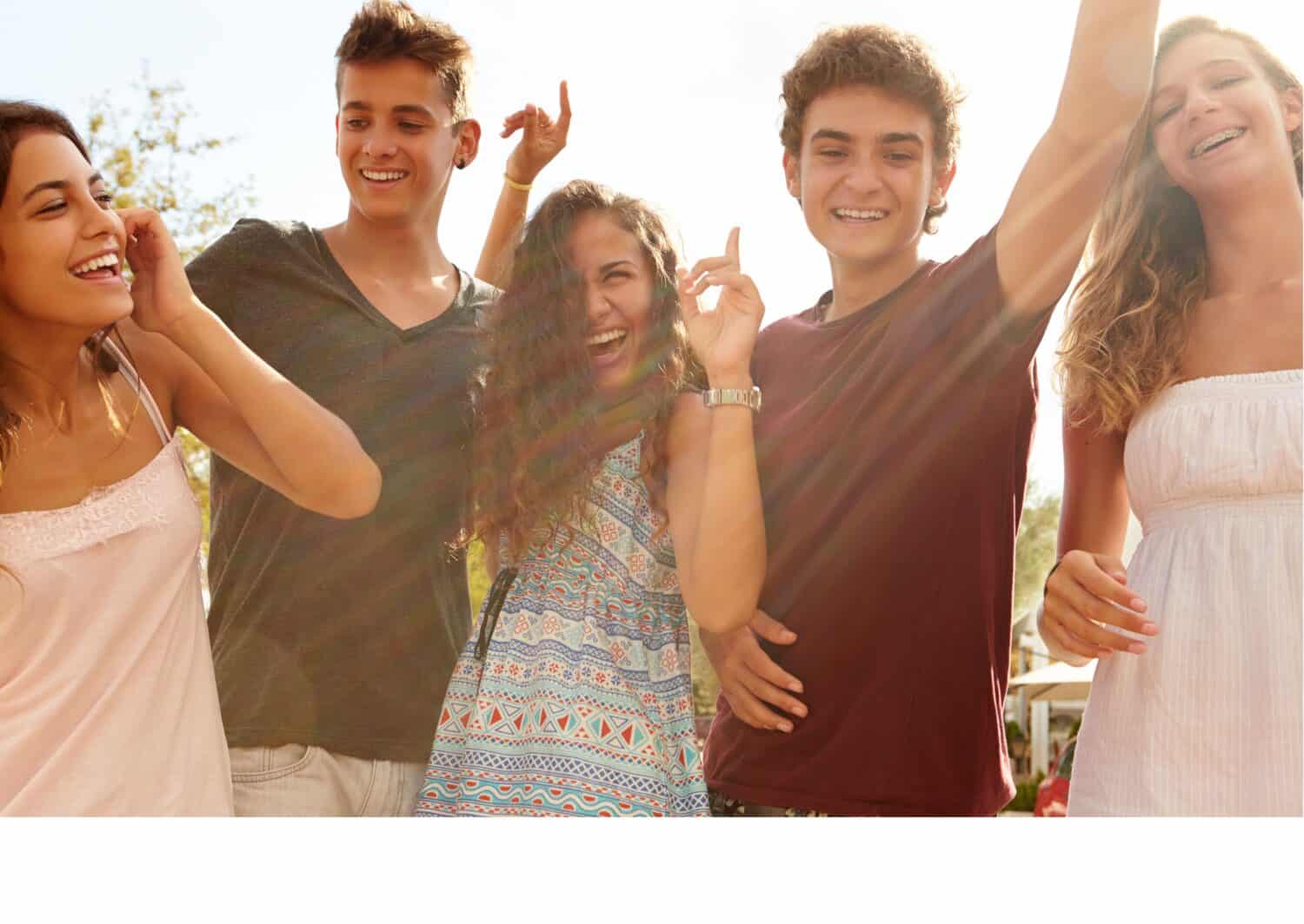 Group of young people looking happy in a sunny photo