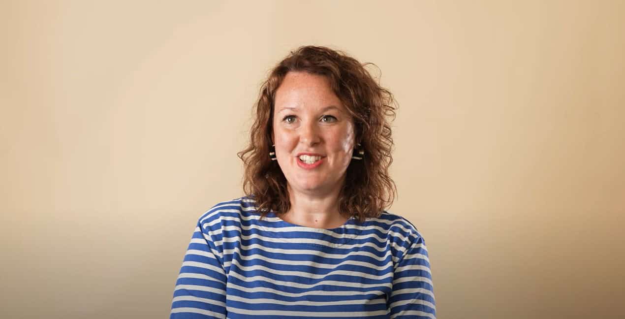 Woman with curly hair speaking