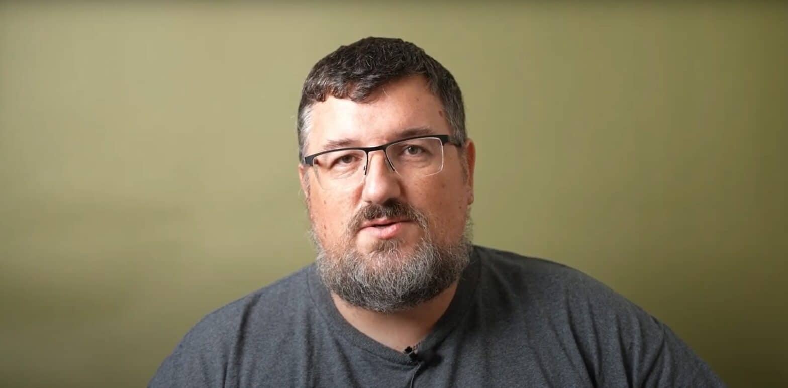 Man against olive background