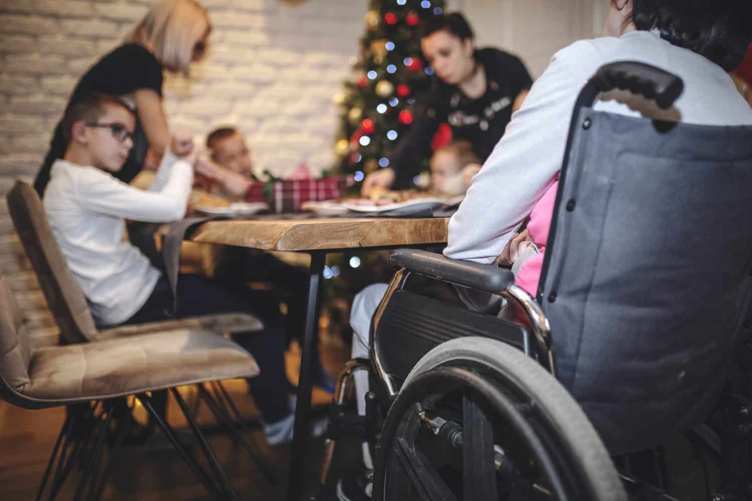 People of diverse abilities enjoying Christmas activities together.