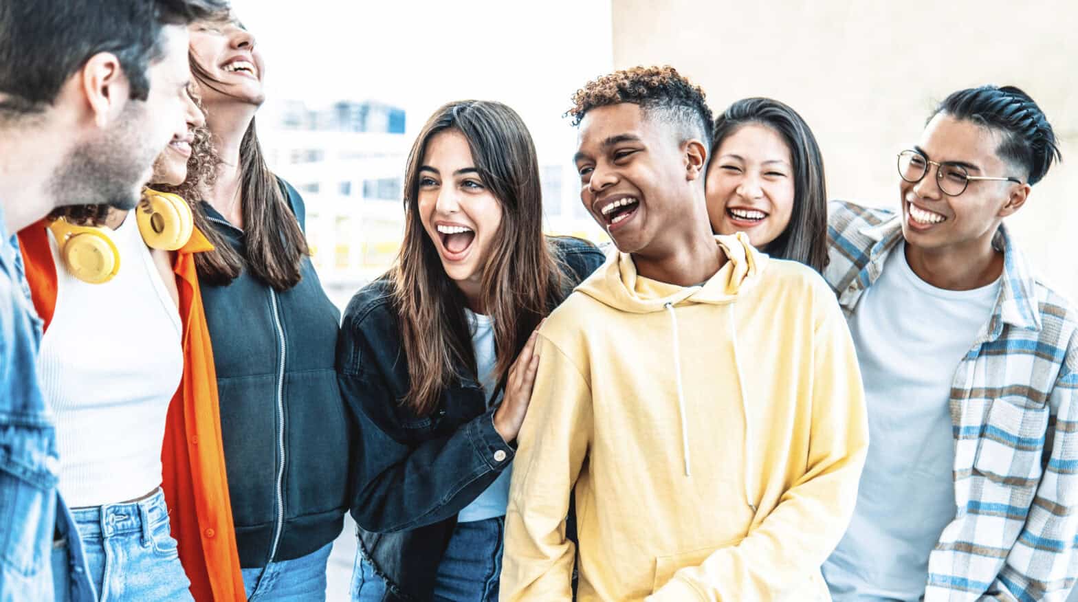 Youth group with seven young people having fun hanging out together