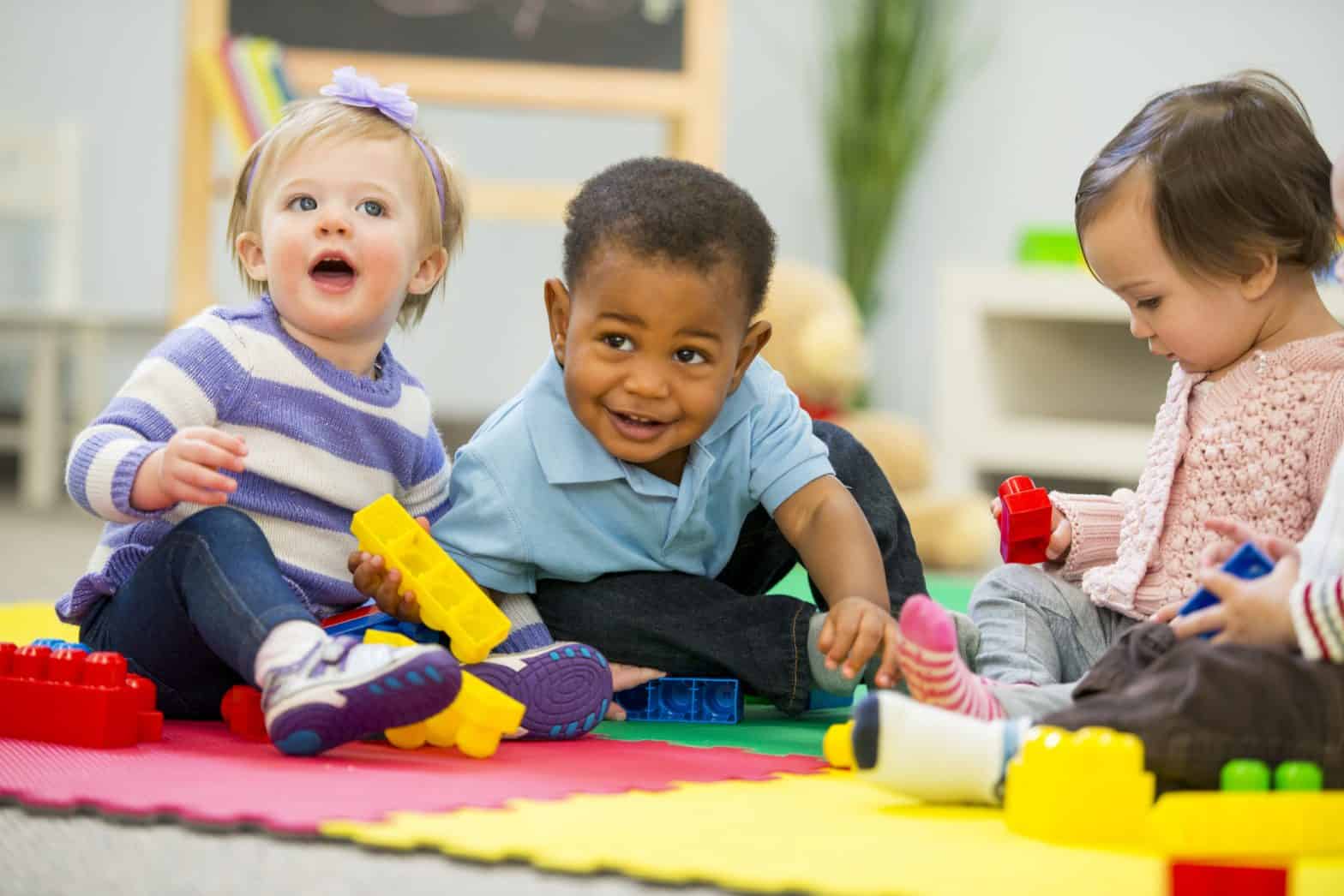 A group of babies playing.
