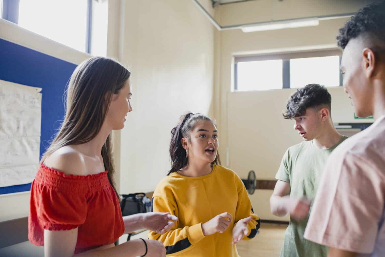 Small group of young people having a conversation at a youth club