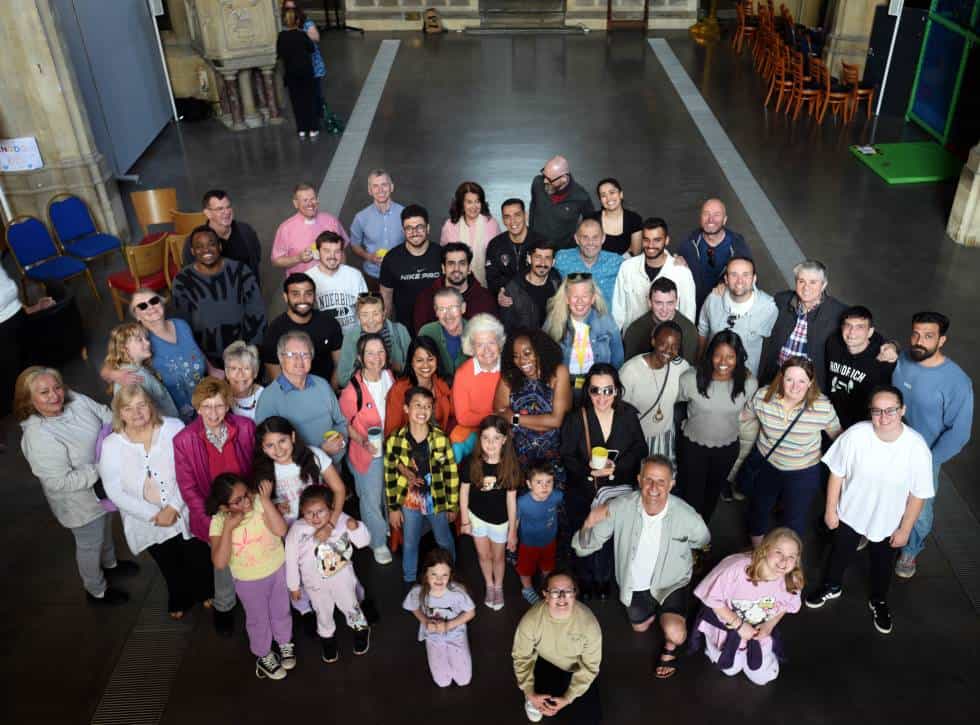 Photo of a church congregation of various ages, taken from above