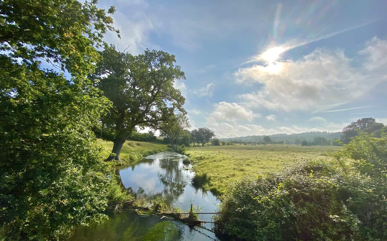 A river running through the country representing a typical rural setting