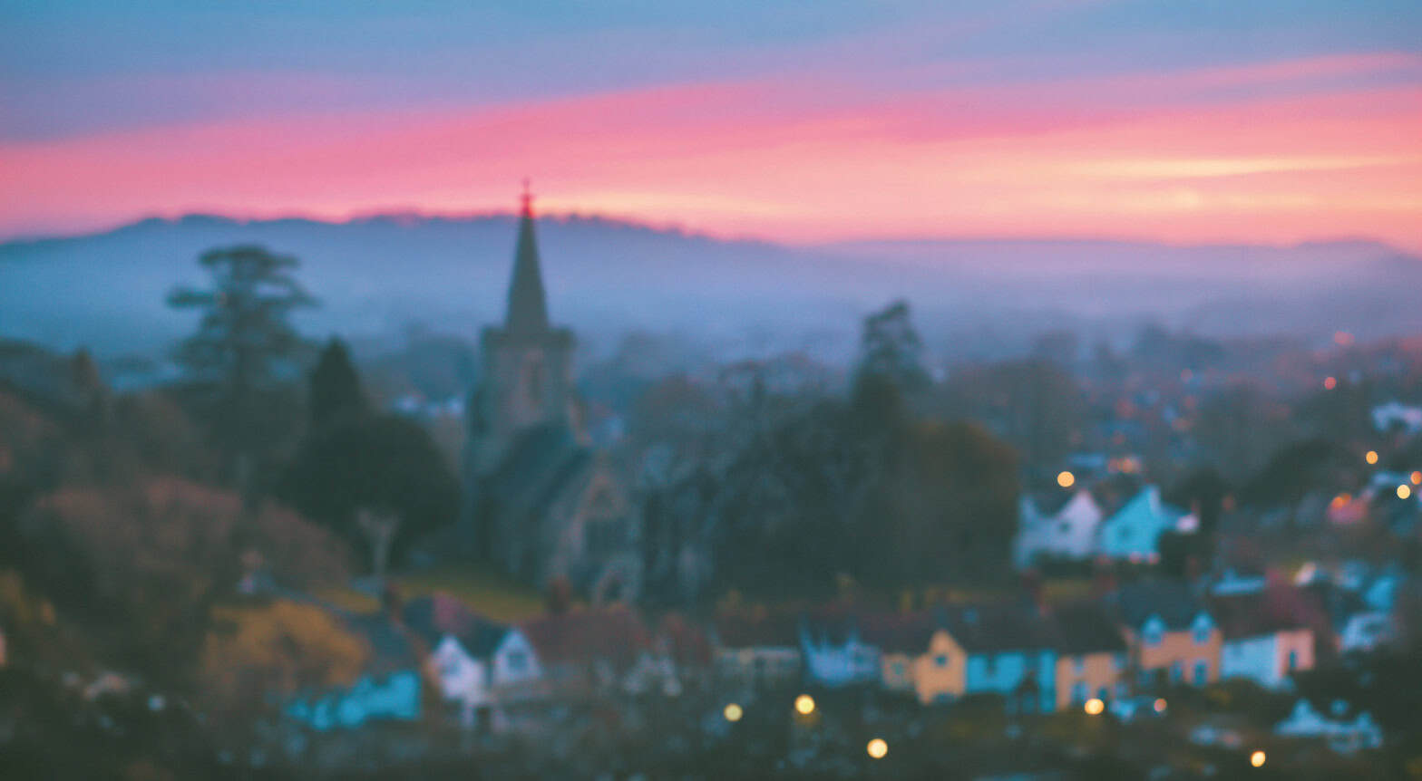 A horizon with a church, houses and trees